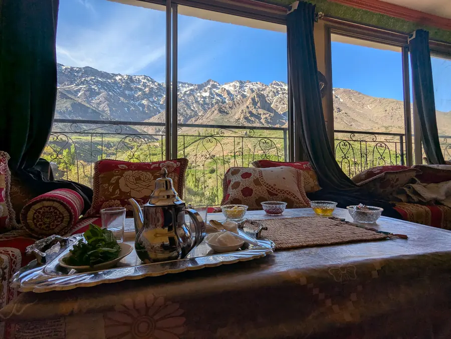 A lounge with mint tea and a view of the Atlas Mountains